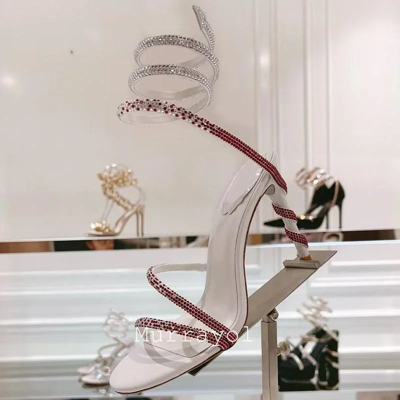 Glitter Crystal Decor High Thin Heels Sandals Women Shiny Snake Shaped Elastic Strap Design Sandalias Summer Party Dress Shoes